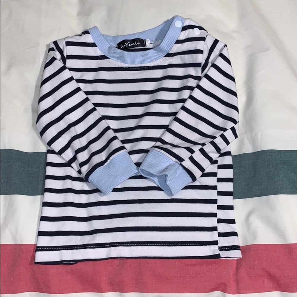 White and blue striped tee with button snap detail